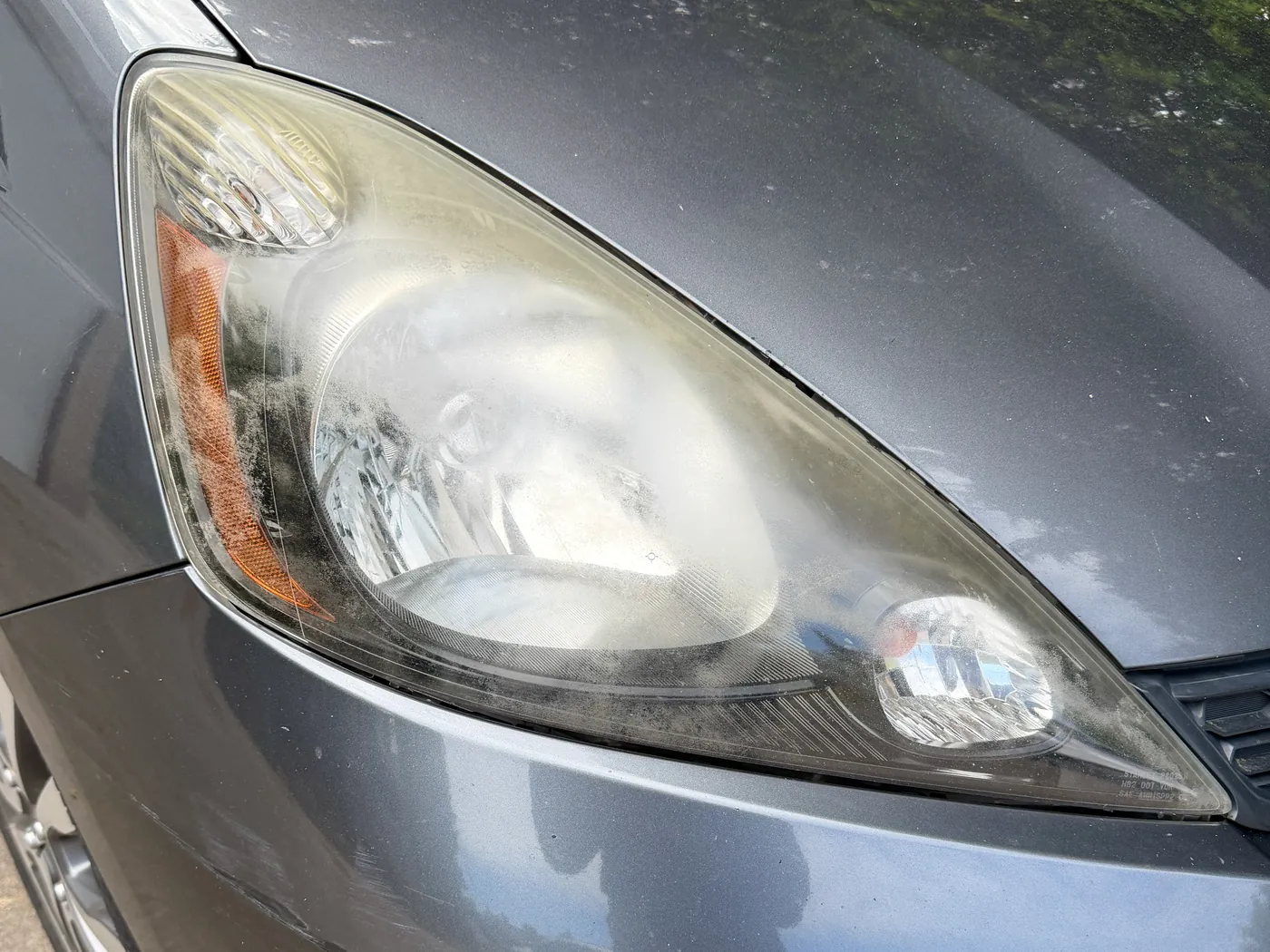 Headlight before restoration — cloudy and oxidized