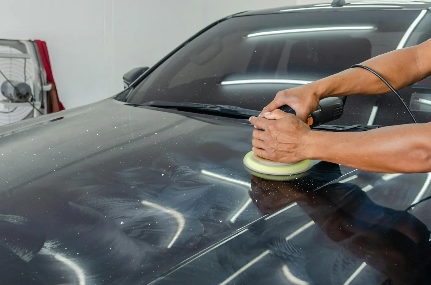 Paint correction with rotary polisher on dark vehicle