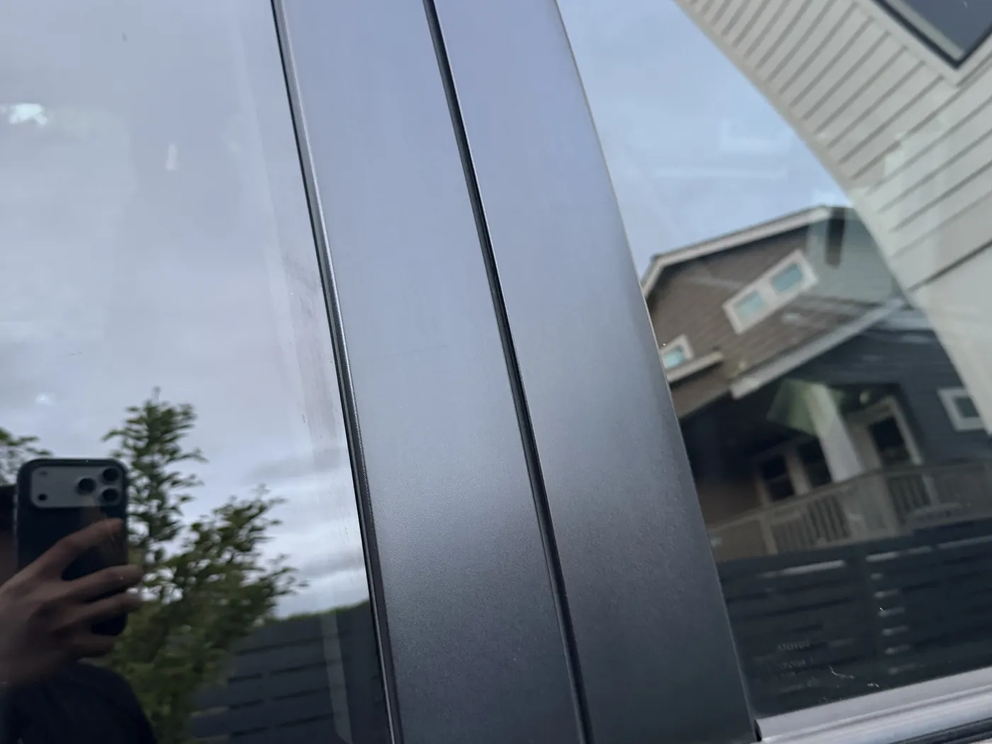 B-pillar trim after restoration — deep black, like new