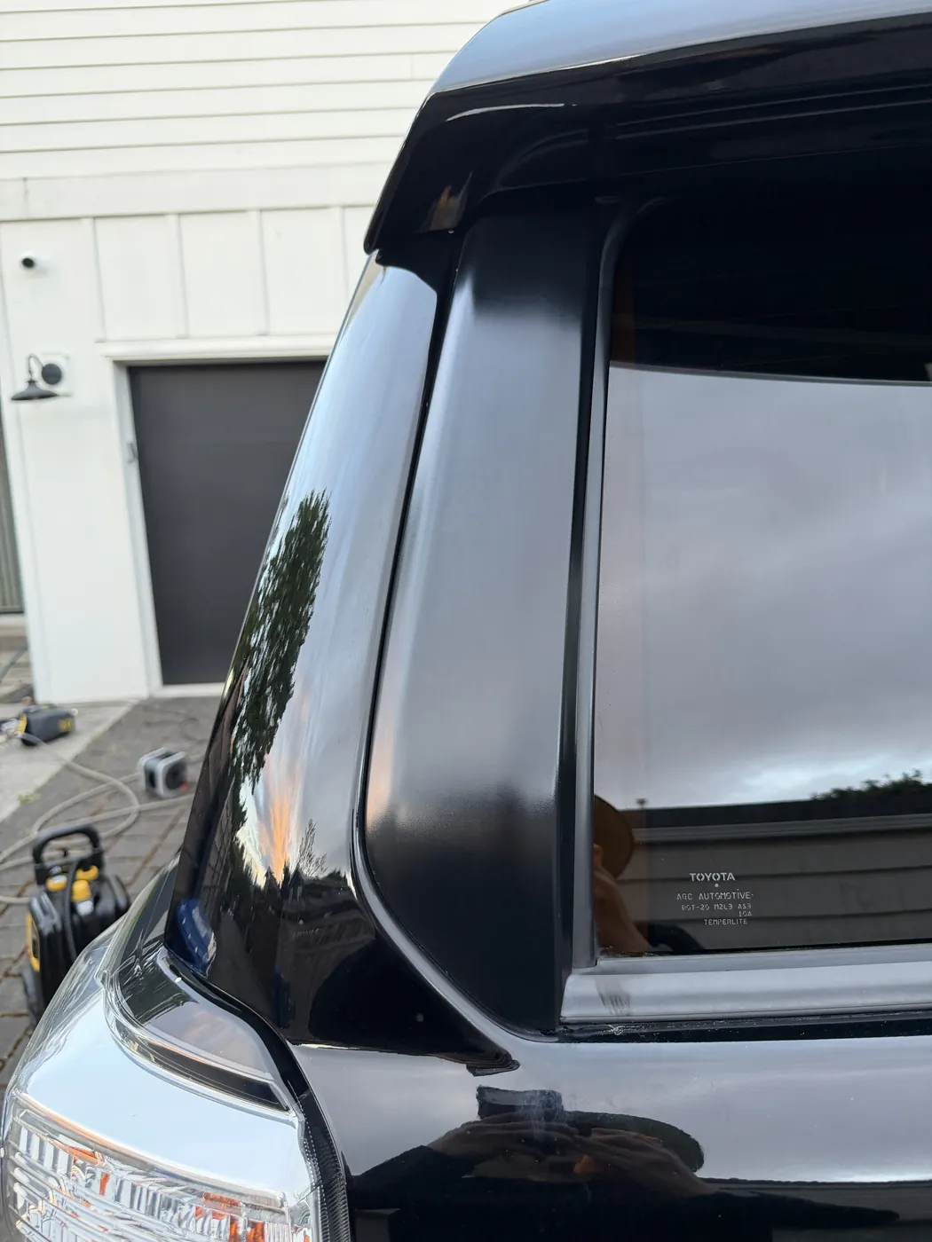 Rear tailgate trim after dressing — rich black finish